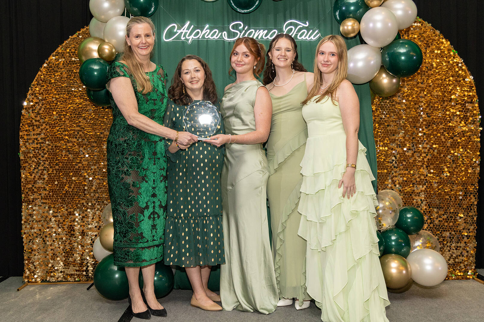 From left are Jamie Jones Miller, Alpha Sigma Tau National President; Katie Perschbacher,  GVSU chapter advisor; and students Shannon Preston, Allie Friesner and Sami Nelson.